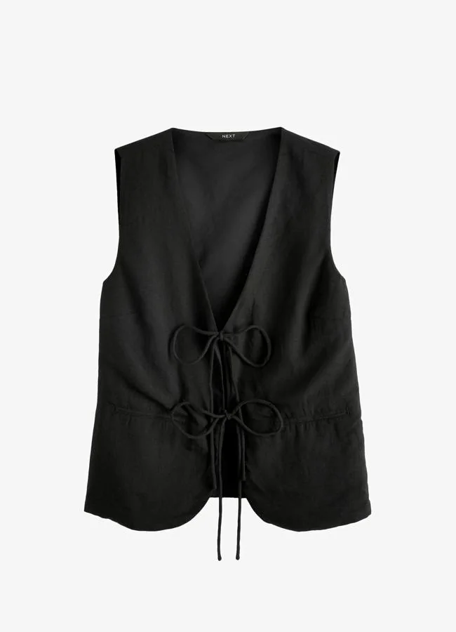 Chaleco negro largo de Next (a la venta en Zalando), 41 euros.