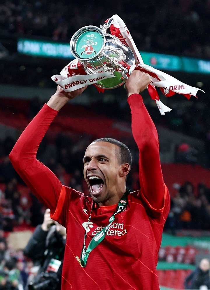 Soccer Football - Carabao Cup Final - Chelsea v Liverpool - Wembley Stadium, London, Britain - February 27, 2022 Liverpool's Joel Matip celebrates with the trophy after winning the Carabao Cup REUTERS/David Klein