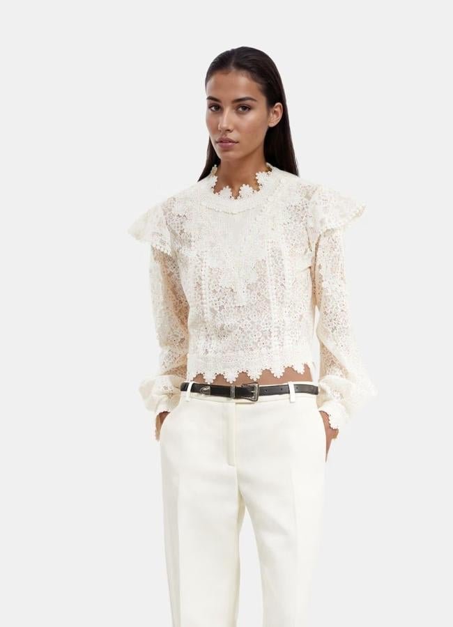 Blusa de encaje semitransparente