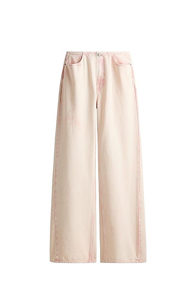 Vaqueros de tiro alto efecto desgastado de H&M Studio.