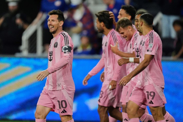 Inter Miami CF midfielder Lionel Messi, left, celebrates after scoring a goal during the second half of an MLS soccer game Wednesday, May 13, 2026, in Cincinnati. (AP Photo/Joshua A. Bickel)
