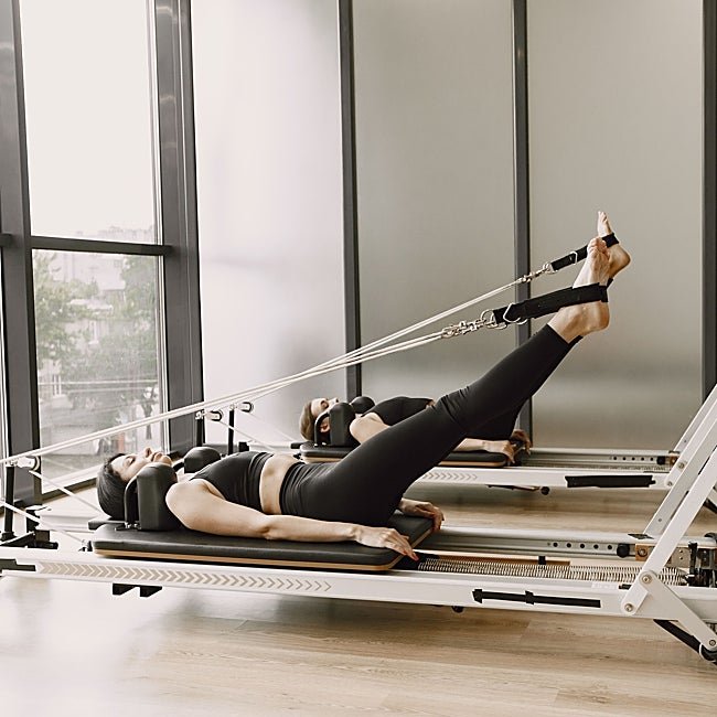 Ejercicio de piernas en reformer.